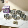 JUEGO DE 5 OLLAS DE ACERO INOXIDABLE CON MANGO DE ACERO DORADO Y TAPAS DE VIDRIO (3) JUEGO DE 5 OLLAS DE ACERO INOXIDABLE CON MANGO DE ACERO DORADO Y TAPAS DE VIDRIO